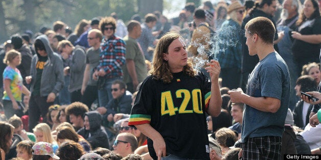 SAN FRANCISCO - APRIL 20: A marijuana user smokes marijuana during a 420 Day celebration on 'Hippie Hill' in Golden Gate Park April 20, 2010 in San Francisco, California. April 20th has become a de facto holiday for marijuana advocates, with large gatherings and 'smoke outs' in many parts of the United States. Voters in California will consider a measure on the November general election ballot that could make the State the first in the nation to legalize the growing of a limited amount of marijuana for private use. (Photo by Justin Sullivan/Getty Images)