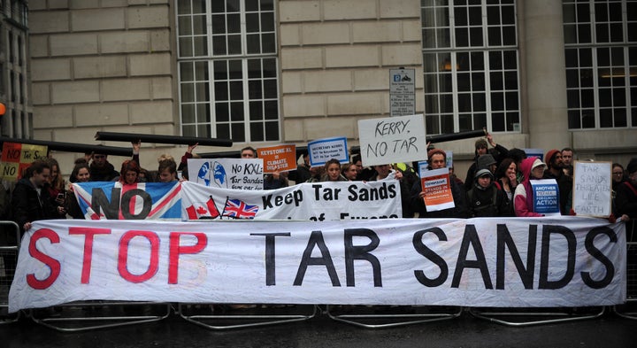 Protesters take part in a rally in central London on April 11, 2013 to demonstrate against the Keystone XL Tar Sands Pipeline as foreign ministers from the G8 group of nations meet nearby. G8 Foreign Ministers will be discussing the situation in Syria, the spiralling North Korean nuclear crisis and Iran's atomic ambitions at their meeting, a prelude to the annual Group of Eight leaders' summit later this year in Northern Ireland. AFP PHOTO/CARL COURT (Photo credit should read CARL COURT/AFP/Getty Images)