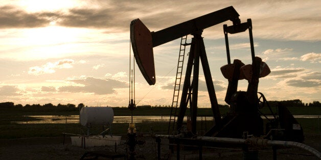 Pumping oil on the prairie at sunset. Great for industrial background.