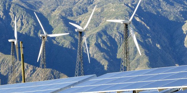 3-14-2015 The San Gorgonio Pass, Palm Springs CA. Solar panels and wind turbines with the San Jacinto Mountains in the background. 