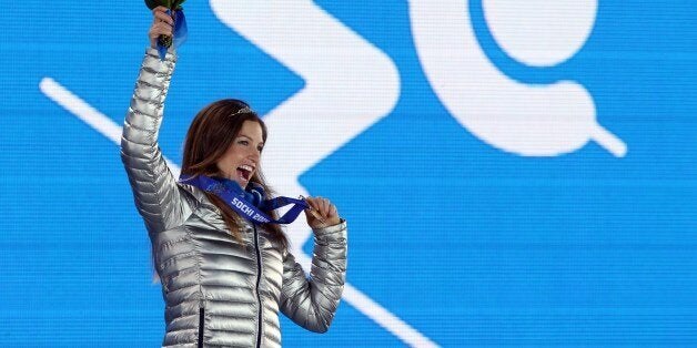 US bronze medalist Julia Mancuso celebrates on the podium during the Women's Alpine Skiing Super Combined Medal Ceremony at the Sochi medals plaza during the Sochi Winter Olympics on February 10, 2014. AFP PHOTO / LOIC VENANCE (Photo credit should read LOIC VENANCE/AFP/Getty Images)