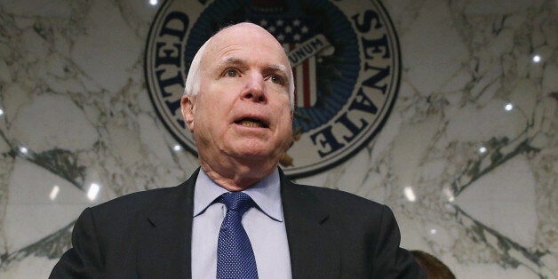 WASHINGTON, DC - JANUARY 21: Chairman Sen. John McCain (R-AZ) prepares to start a Senate Armed Services Committee hearing on Capitol Hill, January 21, 2015 in Washington, DC. The committee heard testimony on from former cabinet officials regarding global challenges and United States national security strategy. (Photo by Mark Wilson/Getty Images)