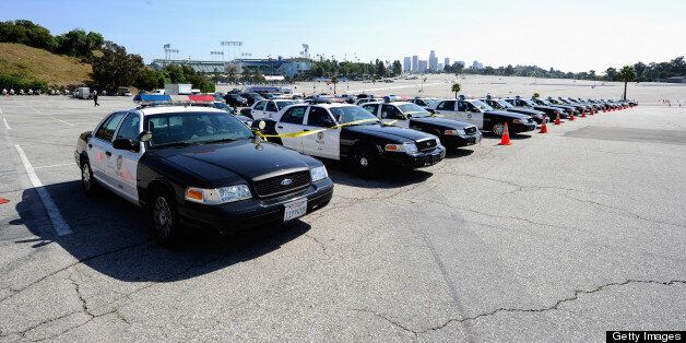 LOS ANGELES, CA - APRIL 14: Los Angeles Police Department patrol cars are deployed at Dodger Stadium prior to the start of a game between the St. Louis Cardinals and the Los Angeles Dodgers on April 14, 2011 in Los Angeles, California. Large numbers of LAPD officers are being deployed as part of a zero tolerance policy toward misbehaving fans in response to the opening day attack on San Francisco Giants fan Bryan Stow two weeks ago. (Photo by Kevork Djansezian/Getty Images)