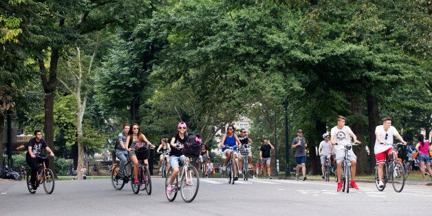 Cyclists ride along the West Drive in New York's Central Park, Tuesday, Sept. 1, 2015. Pope Francis will take a spin through Central Park while visiting New York City this month. The city announced Tuesday that the pontiff will travel through part of the park Sept. 25 before celebrating Mass at Madison Square Garden. (AP Photo/Mark Lennihan)