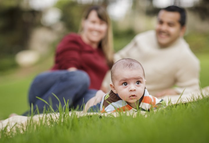 happy mixed race baby boy and...