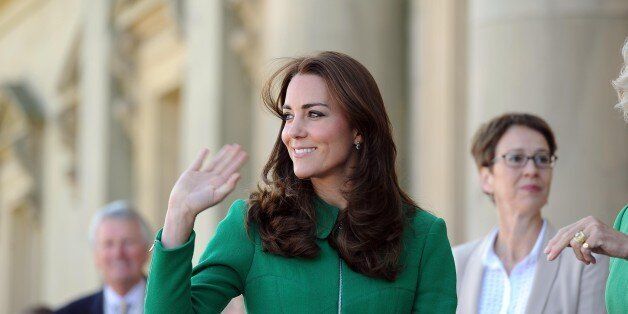 Kate, Duchess of Cambridge, waves to the crowds outside Harewood House, near Leeds, before officially starting the Tour de France. The 198 competitors in the 101st Tour de France have started their grueling three-week ride through four countries before ending the world's greatest cycling race in Paris on July 27. (AP Photo/Asadour Guzelian, Pool)