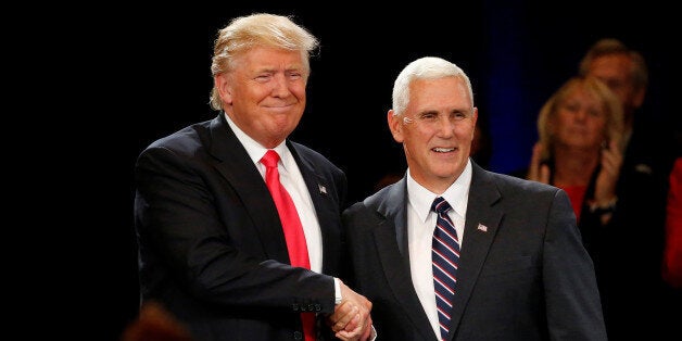 Republican presidential candidate Donald Trump (L) and vice presidential candidate Mike Pence attend a campaign event in Roanoke, Virginia, U.S., July 25, 2016. REUTERS/Carlo Allegri