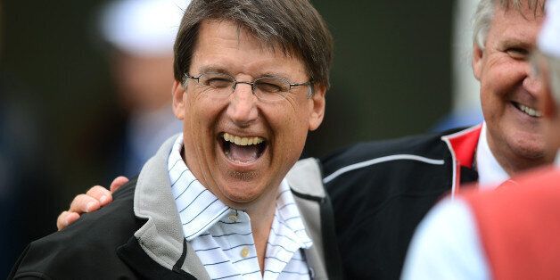 North Carolina Governor Pat McCrory enjoys a laugh at the 10th tee during the Pro-Am at Quail Hollow Club ahead of the Wells Fargo Championship in Charlotte, North Carolina, on Wednesday, May 1, 2013. (Jeff Siner/Charlotte Observer/MCT via Getty Images)