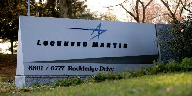 A sign for Lockheed Martin Corp. stands outside the company's headquarters in Bethesda, Maryland, U.S., on Friday, Nov. 16, 2012. President Barack Obama expressed confidence that he and Congress would reach an agreement that will avoid the automatic spending cuts and tax increases that are scheduled to occur at the end of the year. The fiscal cliff is the $607 billion combination of automatic spending cuts and tax increases scheduled to take effect in January. Lawmakers are trying to avert the cliff to prevent a short-term shock to the economy and reach an agreement on long-term deficit reduction. Photographer: Andrew Harrer/Bloomberg via Getty Images