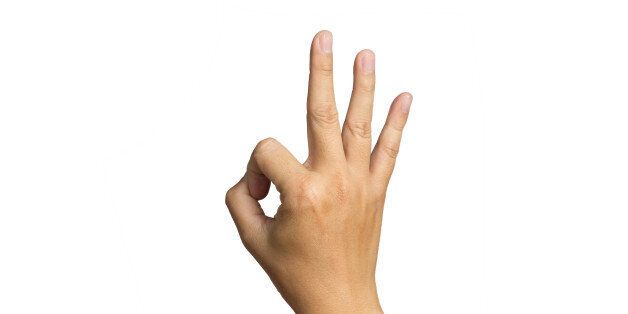hand in ok sign on a white isolated background