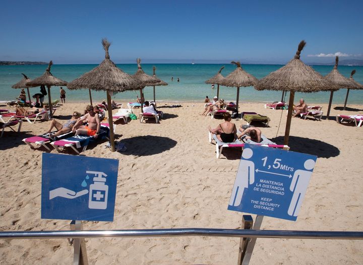 Tourists sunbathe at Palma Beach in Palma de Mallorca on June 7, 2021. - (Photo by JAIME REINA / AFP) (Photo by JAIME REINA/AFP via Getty Images)