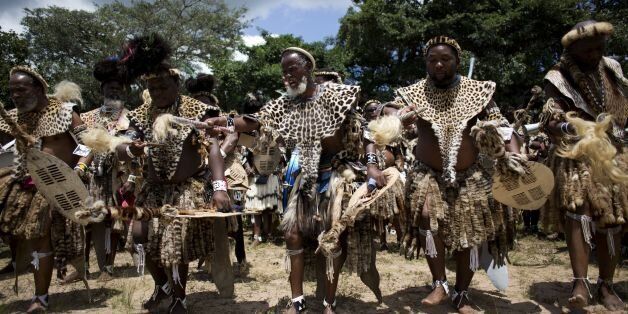 TO GO WITH AFP STORY BY JEAN LIOUSome of the thousands of Shembe men, members of the Shembe Church (Nazareth Baptist Church), a traditionalist Zulu church, dance with their leopard-skin to worship God on January 26, 2014 in Durban. Leopard skins symbolise pride and royalty to the Nazareth Baptist Church, whose members are encouraged to don the costly dress for customary rituals. But as lost habitat and poaching send the cats' numbers plummeting, church leaders have agreed with conservationists to offer a cheaper, kitty-friendly synthetic alternative.'The leopard skin has got a significance, because it shows power,' said church spokesman Lizwi Ncwane, adding that 'We also see the importance of the conservation of the cat.' 'For the past four months now, we have been using fake skins, because we are trying to bring awareness among our people,' Ncwane told AFP. The movement, more commonly known as the Shembe Church, was founded by religious leader Isaiah Shembe a century ago and joins Christianity with Zulu customs. AFP PHOTO / ALEXANDER JOE (Photo credit should read ALEXANDER JOE/AFP/Getty Images)