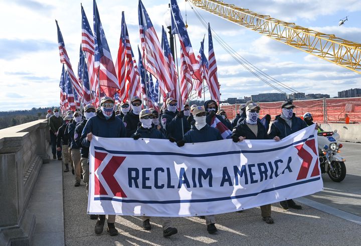 Patriot Front members march from the Lincoln Memorial to the U.S. Capitol, escorted by D.C. Metro Police, on Feb. 8, 2020.