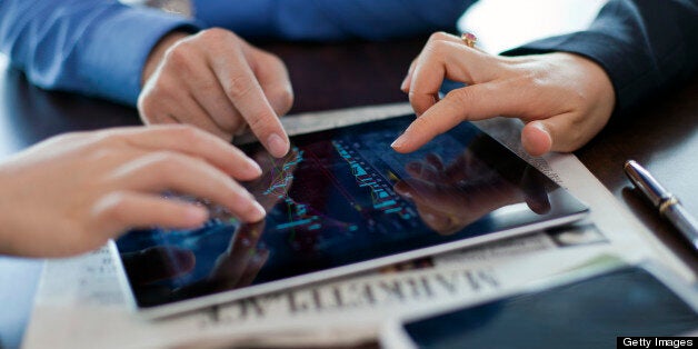 business people in discussion with a tablet PC