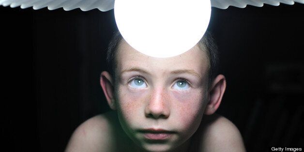 Child watching a lightbuld