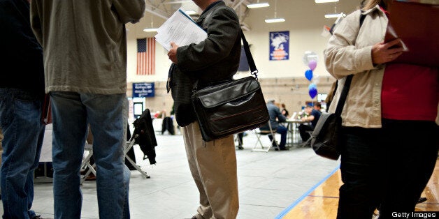 Job seekers mingle with employers during a job fair at Illinois Valley Community College (IVCC) in Oglesby, Illinois, U.S., on Wednesday, April 10, 2013. The U.S. Department of Labor is scheduled to release jobless claims figures on April 11. Photographer: Daniel Acker/Bloomberg via Getty Images