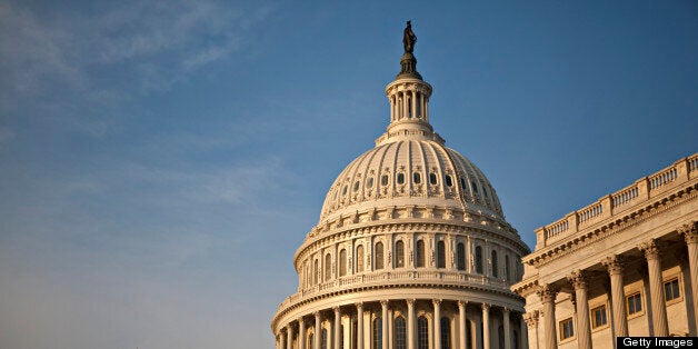 The US Capitol Building is lit by sunlight on a warm spring evening.