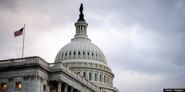 American flags fly outside the U.S. Capitol in Washington, D.C., U.S., on Thursday, Feb. 28, 2013. Democrats and Republicans are in a standoff over how avert $85 billion in federal spending cuts set to start before midnight on March 1. Photographer: Pete Marovich/Bloomberg via Getty Images