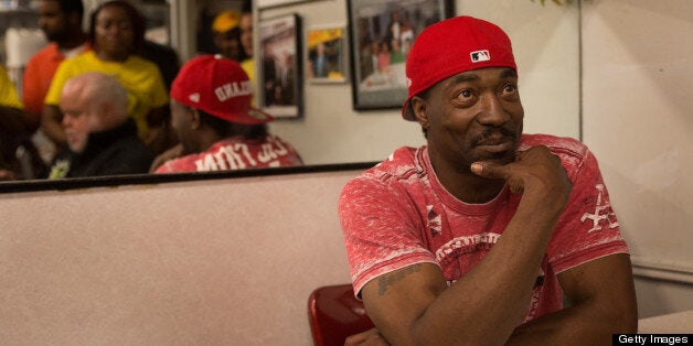 Washington,DC- MAY 11 Washington,DC- MAY 11 Charles Ramsey poses for customers at Ben's Chili Bowl in downtown DC. Talk Show Host Rock Newman who brought Ramsey to town. Ramsey has been hailed a hero for his efforts to free the three women held against their will by Ariel Castro. (Photo by Lucian Perkins/For The Washington Post via Getty Images)