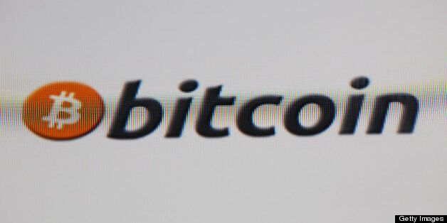 A computer screen displays the Bitcoin logo on an internet website in London, U.K., on Wednesday, April 10, 2013. Bitcoin, developed in 2009 by a mysterious programmer known as Satoshi Nakamoto, is a form of virtual cash that's made secure by complex computations and isn't backed by any government. Photographer: Chris Ratcliffe/Bloomberg via Getty Images