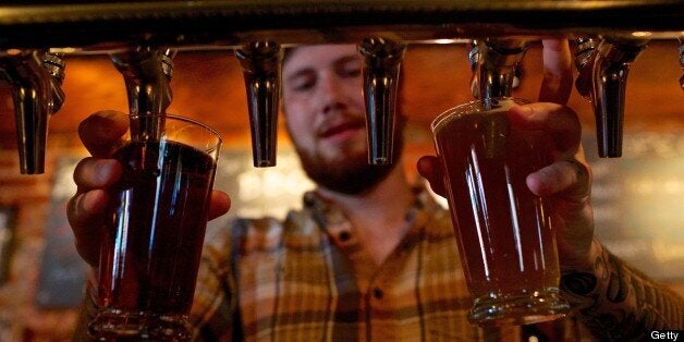 WASHINGTON, DC - JUNE 21: Bartender Ben Brown pours beers from the tap at Meridian Pint on a recent Friday night. According to the restaurant's general manager, Drew Swift, half of the bar's draft list are beers from breweries within a 60-mile radius of the establishment. (Photo by Lexey Swall For the Washington Post)