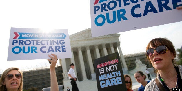 UNITED STATES - JUNE 28: Supporters of the Affordable Care Act rally before the Supreme announces its decision about the constitutionality of the President's efforts on health care reform. (Photo by Chris Maddaloni/CQ Roll Call)