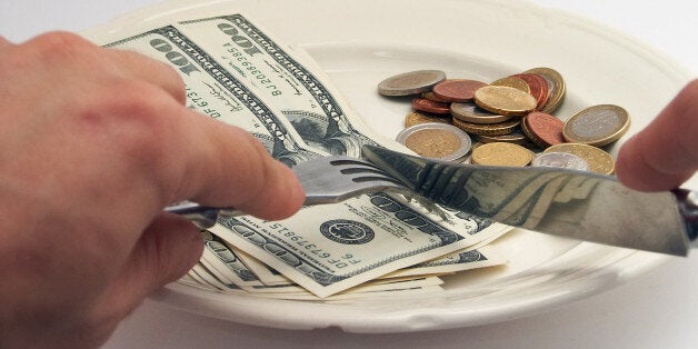 banknotes and coins on a plate...