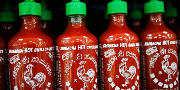 Huy Fong Foods Inc. Sriracha sauce is displayed for sale during the grand opening of a Wal-Mart Stores Inc. location in the Chinatown neighborhood of Los Angeles, California, U.S., on Thursday, Sept. 19, 2013. Wal-Mart Stores Inc. will phase out 10 chemicals it sells in favor of safer alternatives and disclose the chemicals contained in four product categories, the company announced Sept. 12. Photographer: Patrick T. Fallon/Bloomberg via Getty Images