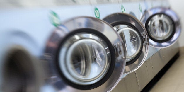 A picture taken on April 29, 2012 shows self-service laundry machines. AFP PHOTO LOIC VENANCE (Photo credit should