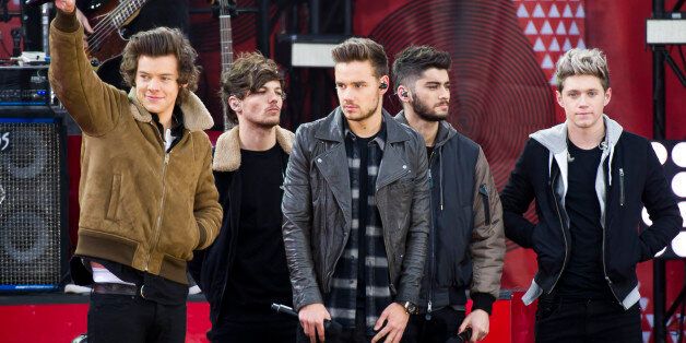 FILE - This Nov. 26, 2013 file photo shows One Direction members, from left, Harry Styles, Louis Tomlinson, Liam Payne, Zayn Malik and Niall Horan on ABC's "Good Morning America"in New York. A representative for One Direction says the bandâs lawyers are dealing with a video showing two band members smoking what the singers referred to as an âillegal substance.â British tabloid The Daily Mail posted a five-minute clip Tuesday, May 27, 2014, of Zayn Malik smoking and speaking with Louis Tomlinson, who is filming. (Photo by Charles Sykes/Invision/AP, File)