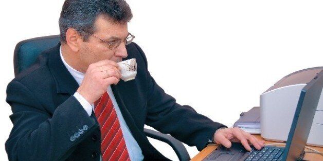 this is businessman doing his work during a coffee-break