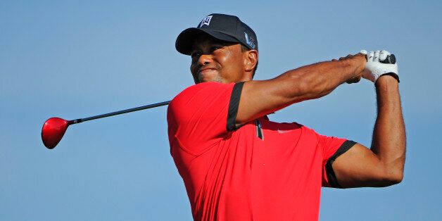 JERSEY CITY, NJ - AUGUST 25: Tiger Woods watches his tee shot on the 15th hole during the final round of The Barclays at Liberty National Golf Club on August 25, 2013 in Jersey City, New Jersey. (Photo by Chris Condon/PGA TOUR) 
