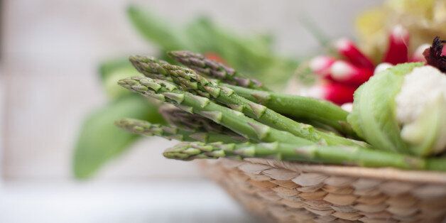 Asparagus in basket of vegetables