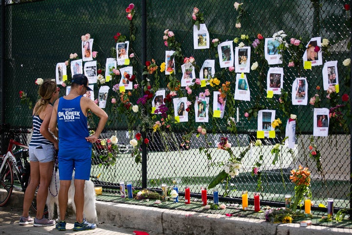 People visit a makeshift memorial at the site of the collapsed building on Saturday. An engineer warned of "major structural