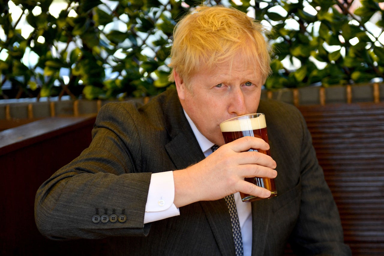 Boris Johnson, sips a pint of beer at a pub in Wolverhampton