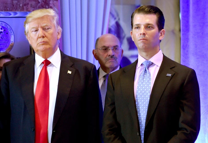 President-elect Donald Trump and his son Donald Trump Jr. arrive for a press conference at Trump Tower in New York, as Allen Weisselberg (center), chief financial officer of The Trump Organization, looks on, Jan. 11, 2017.