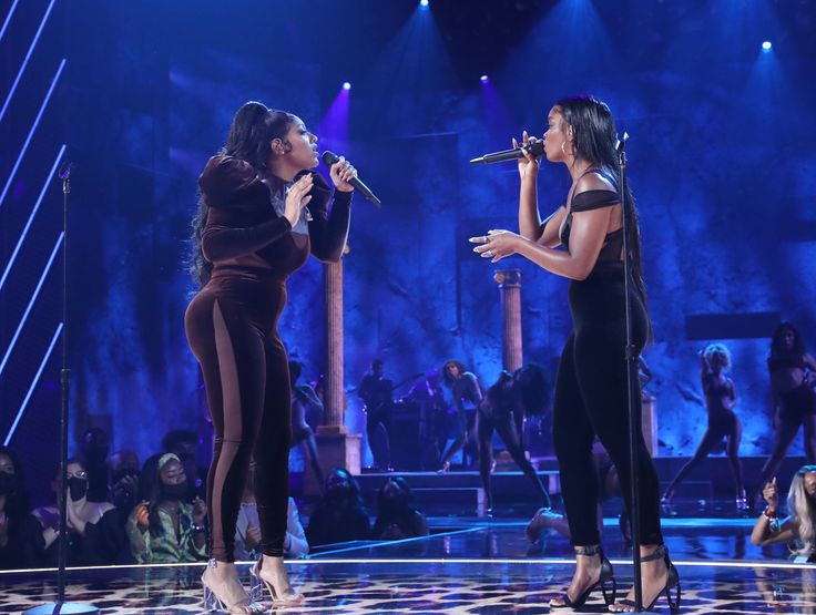 (L-R) Jazmine Sullivan and Ari Lennox perform onstage at the BET Awards 2021.