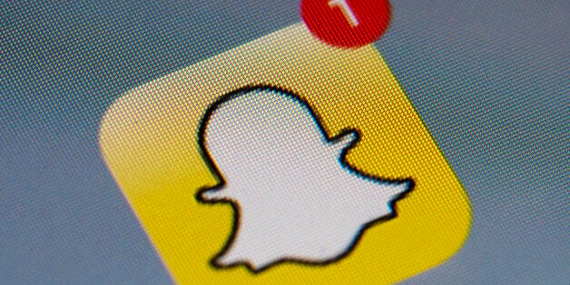 The logo of mobile app 'Snapchat' is displayed on a tablet on January 2, 2014 in Paris. Hackers broke into Snapchat, the hugely popular mobile app, accessing the phone numbers and usernames of 4.6 million users and publishing them online, tech news website TechCrunch has announced. AFP PHOTO / LIONEL BONAVENTURE (Photo credit should read LIONEL BONAVENTURE/AFP/Getty Images)