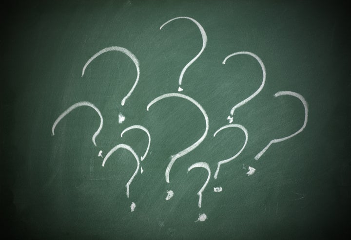 question marks on a blackboard