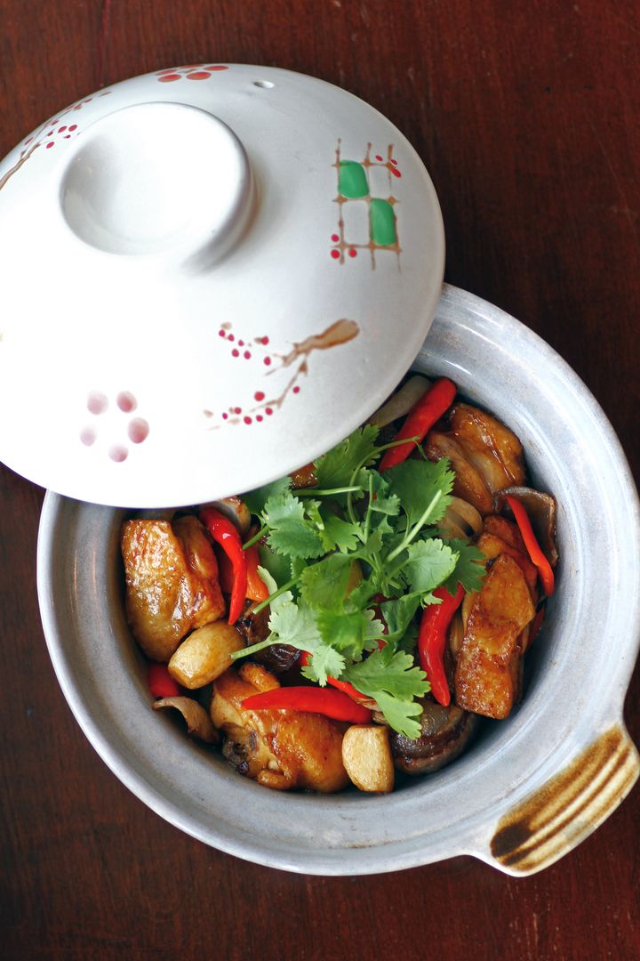 Chinese cuisine: Braised Chicken in Clay Pot with Shallot and Coriander in Homemade Spicy Sauce