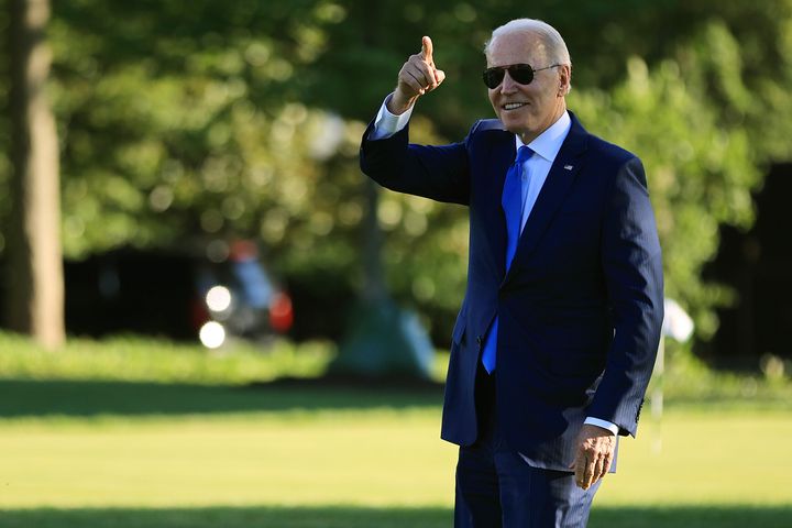WASHINGTON, DC - JUNE 25: U.S. President Joe Biden points to staff members from the South Lawn as he departs the White House on June 25, 2021 in Washington, DC. Biden is scheduled to spend the weekend at Camp David. (Photo by Chip Somodevilla/Getty Images)