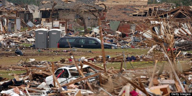 MOORE, OK - MAY 26: U.S. President Barack Obama's motorcade exits the tornado ravaged Plaza Towers Elementary School after visiting with residents and families on May 26, 2013 in Moore, Oklahoma. The tornado of EF5 strength and two miles wide touched down May 20 killing at least 24 people and leaving behind extensive damage to homes and businesses. U.S. President Barack Obama promised federal aid to supplement state and local recovery efforts. (Photo by Tom Pennington/Getty Images)