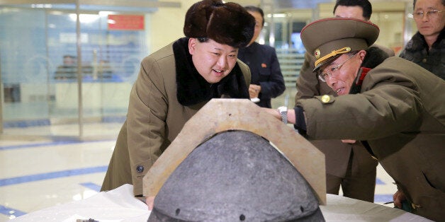 FILE PHOTO: North Korean leader Kim Jong Un looks at a rocket warhead tip after a simulated test of atmospheric re-entry of a ballistic missile, at an unidentified location in this undated photo released by North Korea's Korean Central News Agency (KCNA) in Pyongyang on March 15, 2016. KCNA/File Photo via REUTERS ATTENTION EDITORS - THIS IMAGE WAS PROVIDED BY A THIRD PARTY. EDITORIAL USE ONLY. REUTERS IS UNABLE TO INDEPENDENTLY VERIFY THIS IMAGE. NO THIRD PARTY SALES. SOUTH KOREA OUT. NO COMMERCIAL OR EDITORIAL SALES IN SOUTH KOREA