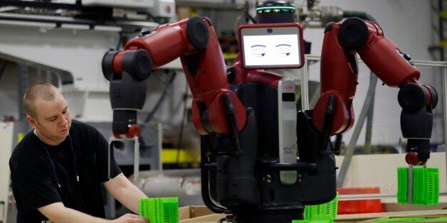 A technician works with Baxter, an adaptive manufacturing robot created by Rethink Robotics at The Rodon Group manufacturing facility, Tuesday, March 12, 2013, in Hatfield, Pa. There are three jobs open at Rodon Group, a plastic parts manufacturer near Philadelphia. But despite the reports of a shortage of skilled workers nationwide, CEO Michael Araten isn't sweating it. (AP Photo/Matt Rourke)