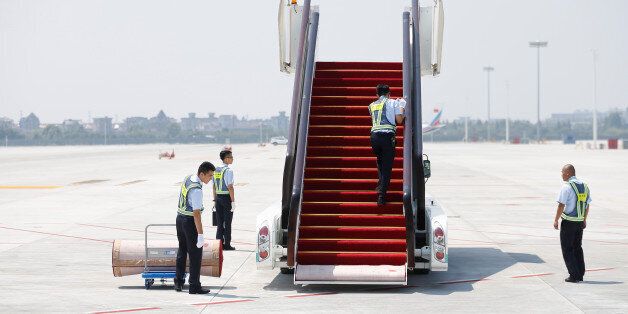 Security personnel stand next to airstair as they prepare for foreign leaders' arrivals at the Hangzhou Xiaoshan international airport before the G20 Summit in Hangzhou, Zhejiang province, China September 2, 2016. REUTERS/Aly Song