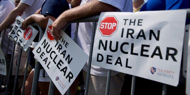 An attendee places his hands over his heart during the Pledge of Allegiance at a Tea Party Patriots rally against the Iran nuclear deal on Capitol Hill in Washington, D.C., U.S., on Wednesday, Sept. 9, 2015. A revolt among U.S. House Republicans delayed action on the Iran nuclear deal today as some members insisted they aren't bound by a Sept. 17 deadline in their efforts to kill the agreement. Photographer: Andrew Harrer/Bloomberg via Getty Images