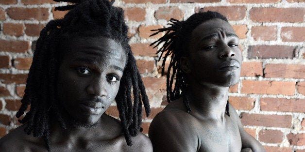 WASHINGTON, D.C., SEPTEMBER 17, 2013: Rappers Pacman, 19, left, and Peso, 20, pose for a portrait photograph.. Peso, who grew up in Landover, MD, and his music partner Pacman, who grew up in the Congress Heights neighborhood in Southeast, are two young men who plan to make a music video in North Korea. They're working with a local music producer and raise the money they need fro their project on Kickstarter. Both young men are gifted artists who are trying to improve their lives despite many challenging circumstances. (Photo by Astrid Riecken for The Washington Post via Getty Images)