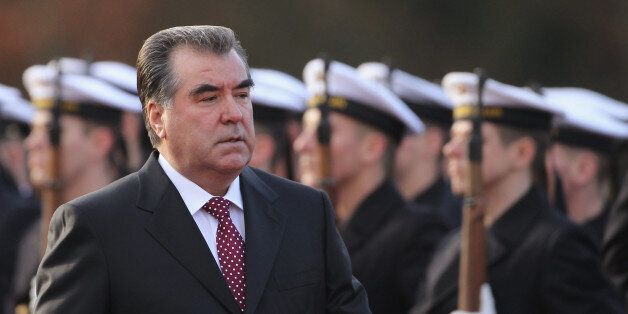 BERLIN, GERMANY - DECEMBER 14: Tajik President Emomalii Rahmon reviews a guard of honour with German President Christian Wulff (not pictured) during an official visit by Rahmon at Bellevue Palace on December 14, 2011 in Berlin, Germany. Rahmon is on a three-day official visit to Berlin. (Photo by Sean Gallup/Getty Images)