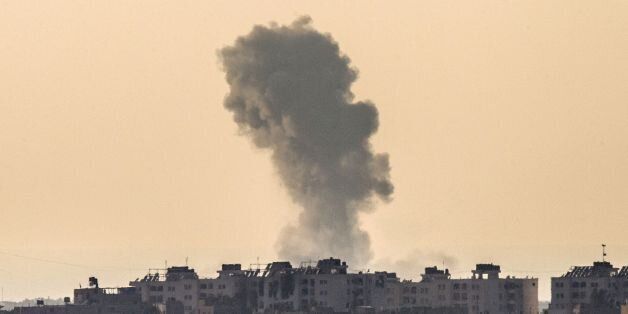 A picture taken from the Israel-Gaza border shows smoke rising from the coastal side of the Gaza strip following an Israeli military strike on August 4, 2014. Israel insisted there will be no end to its bloody military campaign in Gaza without achieving long-term security for its people, shunning increasingly vocal world demands for a truce. AFP PHOTO / JACK GUEZ (Photo credit should read JACK GUEZ/AFP/Getty Images)
