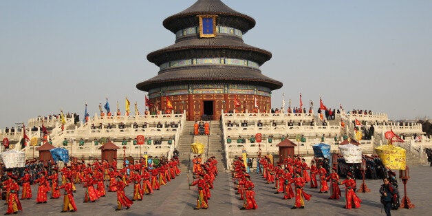 Performers dressed in costumes of the Qing Dynasty (AD 1644-1911) rehearse the ancient royal heaven worshiping ceremony for the upcoming Lunar New Year or Spring Festival at the Temple of Heaven in Beijing on January 29, 2014. The sacred ceremony is a unique performance to replicate the proceedings carried out in the Qing Dynasty by emperors to pray for peace and prosperity of the nation. CHINA OUT AFP PHOTO (Photo credit should read STR/AFP/Getty Images)